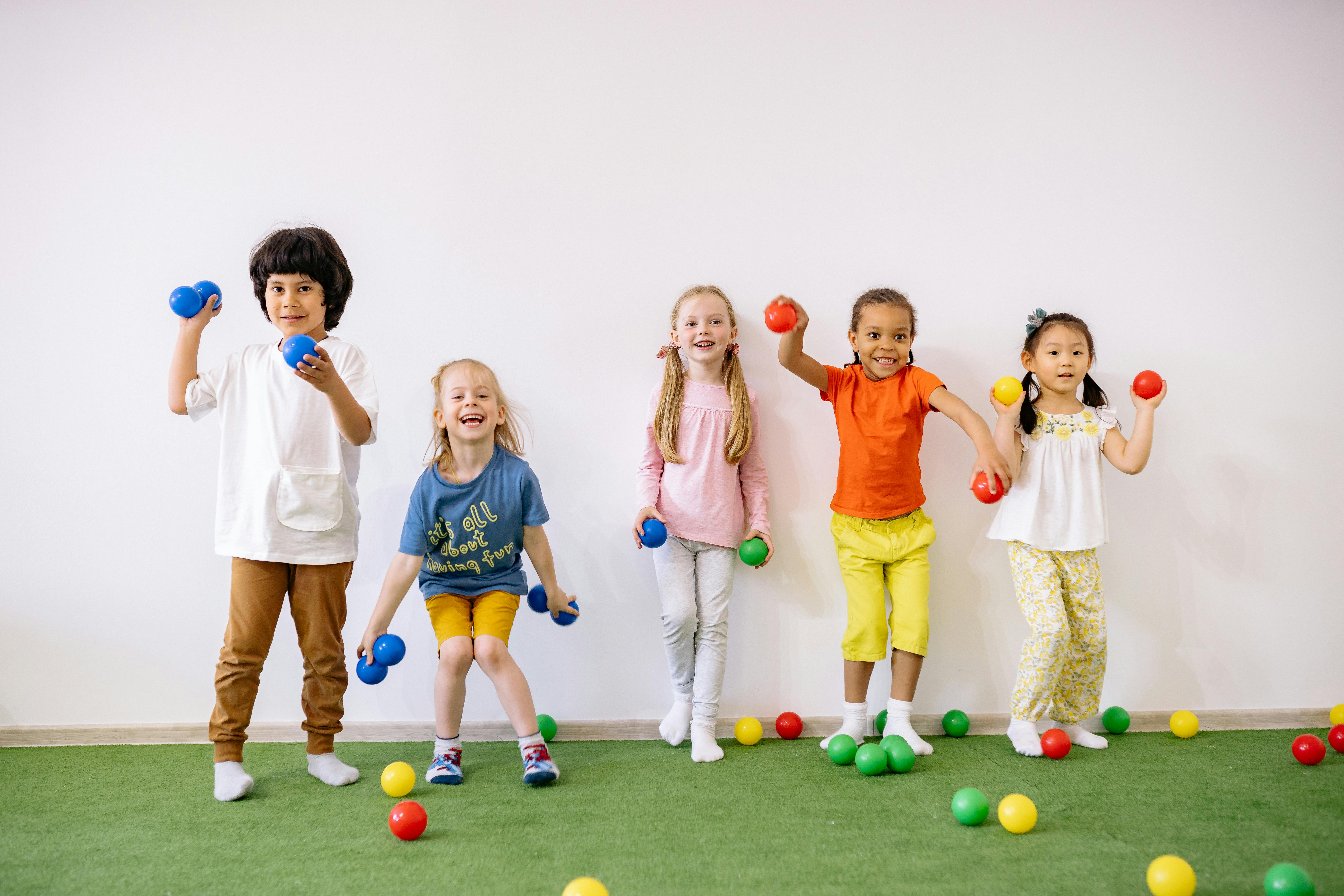 Children throwing a ball in a movement activity